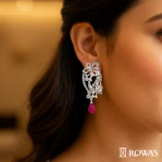 Garden of Eden Earrings in Rosecut Diamonds Gross wt – 23.67 gms Gold wt – 19.63 gms Diamonds – 1.28 cts Rosecuts – 2.44 cts Ruby – 16.48 cts Inspired by the lush and enchanting beauty of the mythical Garden of Eden, these Earrings features cascading ruby beads that symbolize the abundance of nature. The intricate diamond floral motifs represent the garden’s exquisite blooms, creating a harmonious blend of natural beauty and luxury. This piece is perfect for those who appreciate the elegance and wonder of a paradisiacal garden.