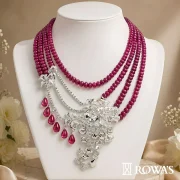 Garden of Eden Necklace in Rosecut Diamonds Gross wt – 61.08 gms Gold wt – 47.19 cts Diamond Wt – 9.9 cts Ruby mala – 686.8 cts Ruby – 59.55 cts Inspired by the lush and enchanting beauty of the mythical Garden of Eden, this necklace features cascading ruby beads that symbolize the abundance of nature. The intricate diamond floral motifs represent the garden’s exquisite blooms, creating a harmonious blend of natural beauty and luxury. This piece is perfect for those who appreciate the elegance and wonder of a paradisiacal garden.